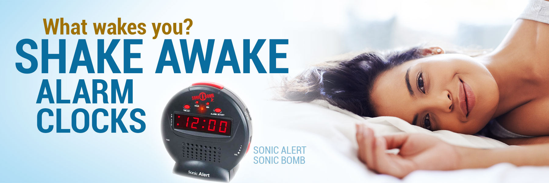 Lady laying on her side in bed.  Shake awake alarm clocks vibrate and flash to wake up the Deaf and hard of hearing. 