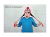Child with a red and white striped hat pulling on it, with text 'Where is my hearing aid?'