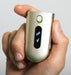 Phonak Roger Neckloop Universal Receiver 056-4005-P5111 view of the display screen, on/off button held in someone's right hand. 